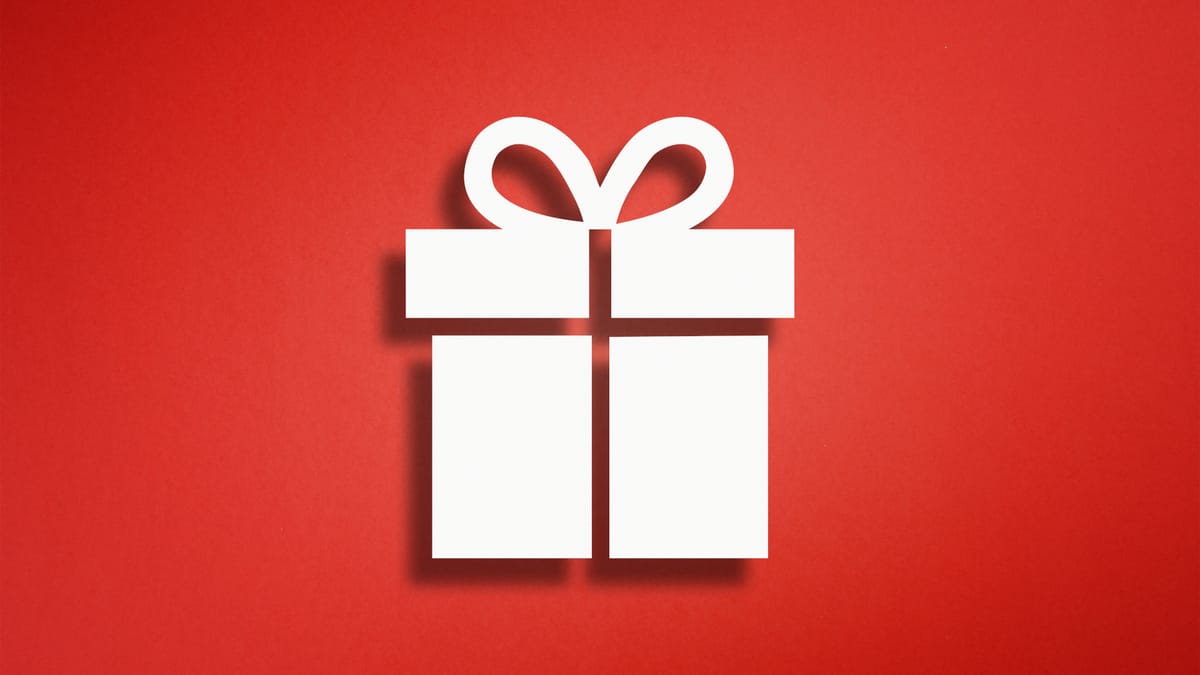 Weißes Piktogramm eines Geschenks mit Schleife auf rotem Hintergrund.
